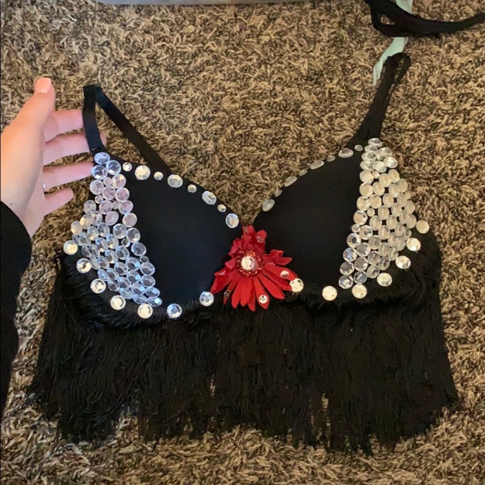 Black rhinestone rave bra with a red daisy